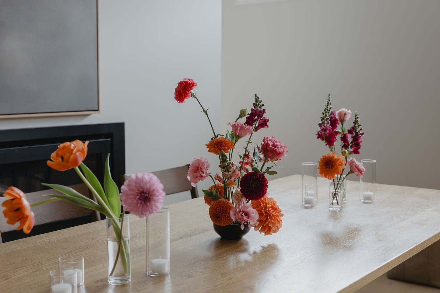 Floral arrangements on a table with a neutral background