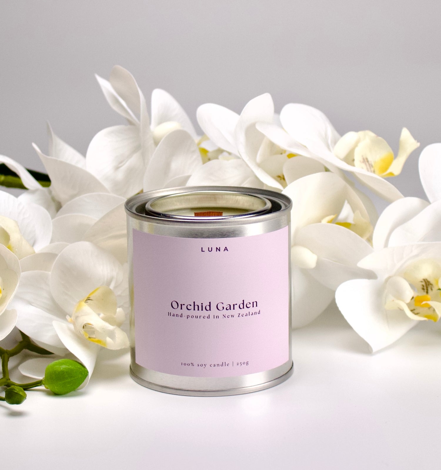 Orchid Garden candle close-up with botanical inspired packaging