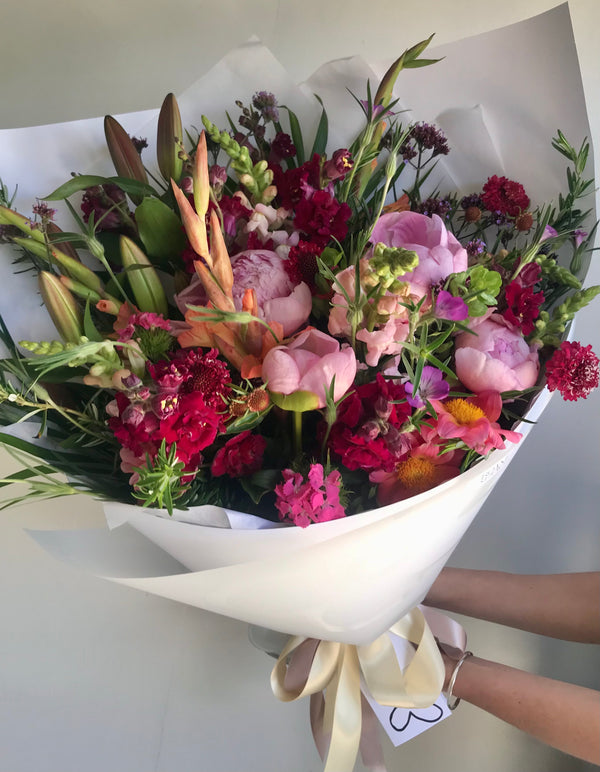 Peony and mixed flower bouquet in pink and red garden flowers