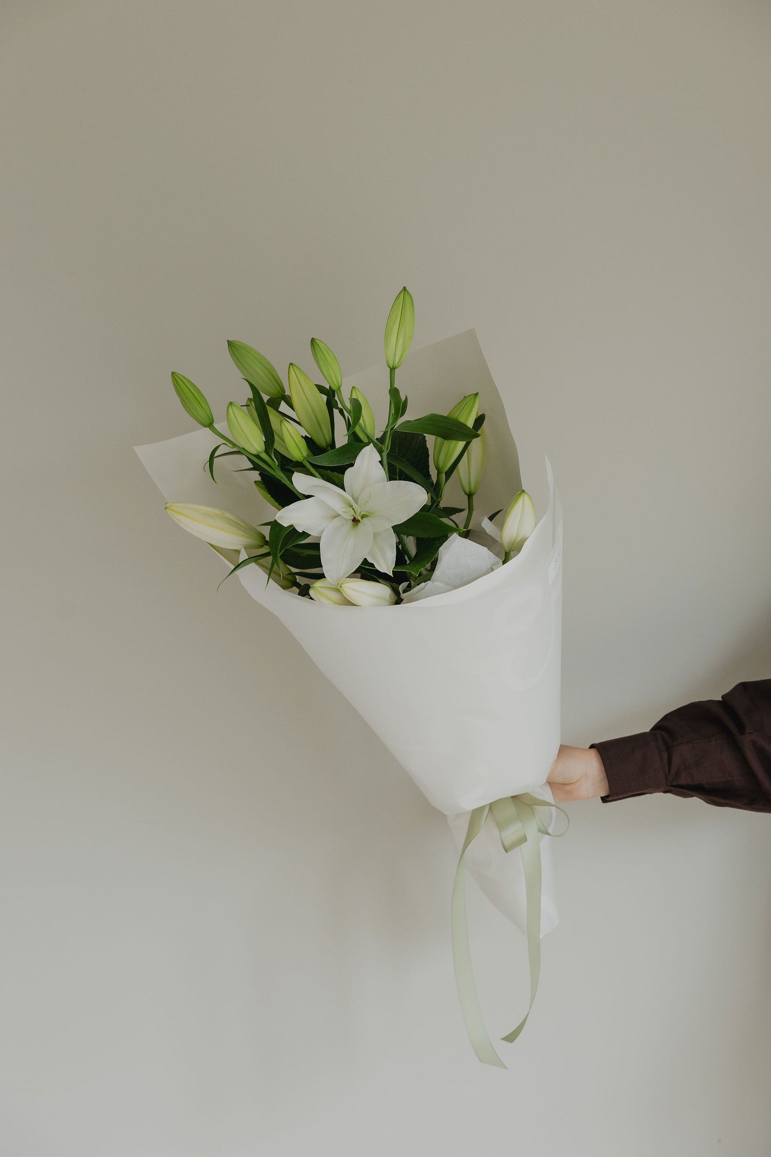 Good Karma lily bouquet gift wrapped for flower delivery