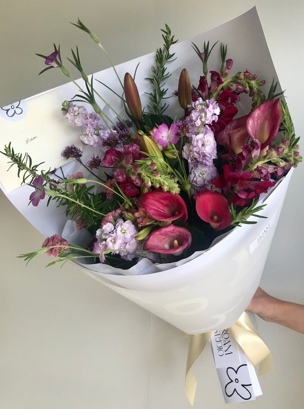 Wild flower bouquet in purple and reds